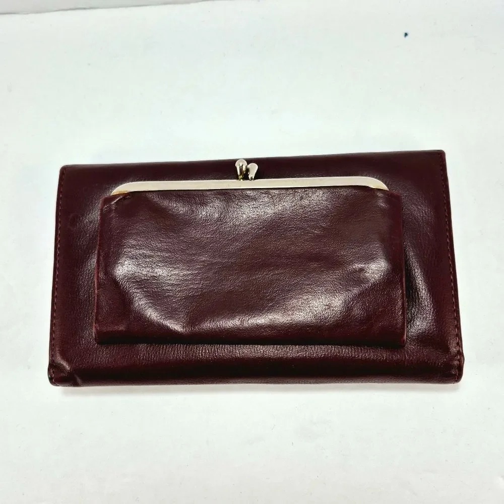 Vintage Full-Grain Cowhide Checkbook-Style Wallet With A Snap Closure.